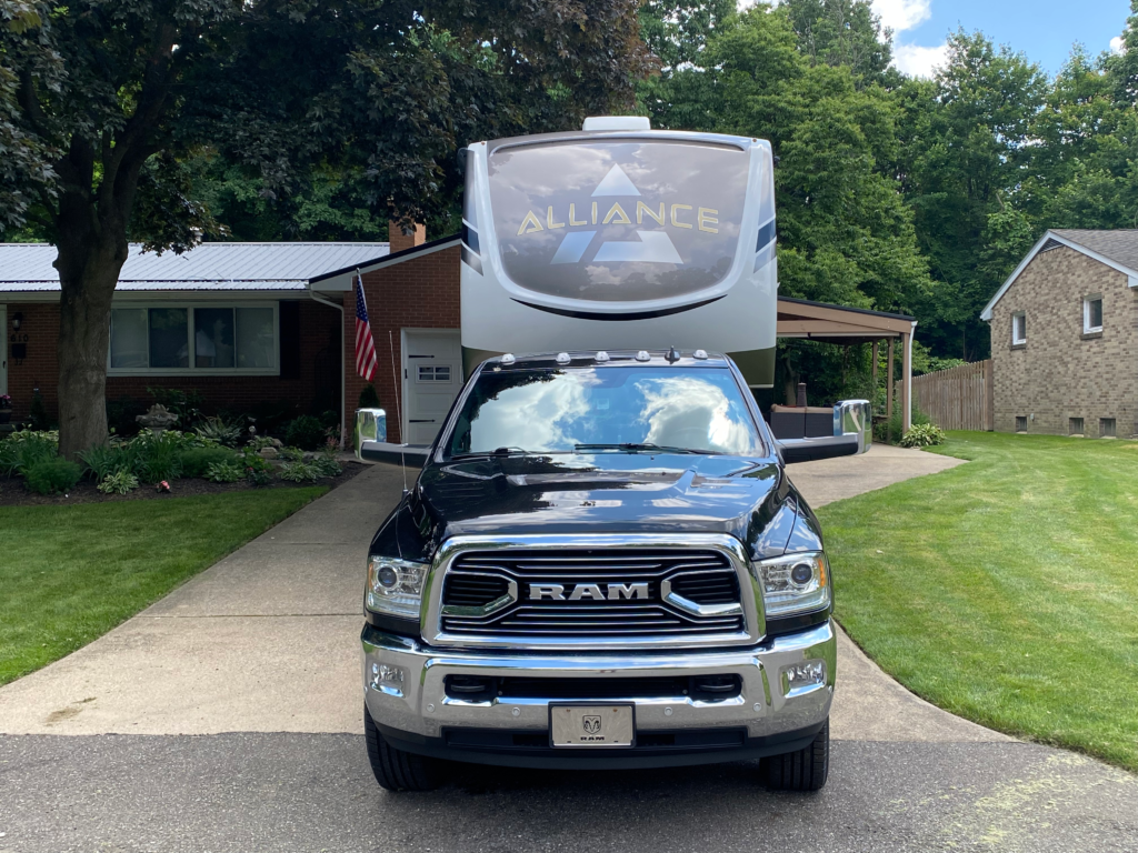 2021 Alliance Paradigm 310RL fifth wheel parked in a driveway as our current RV rig